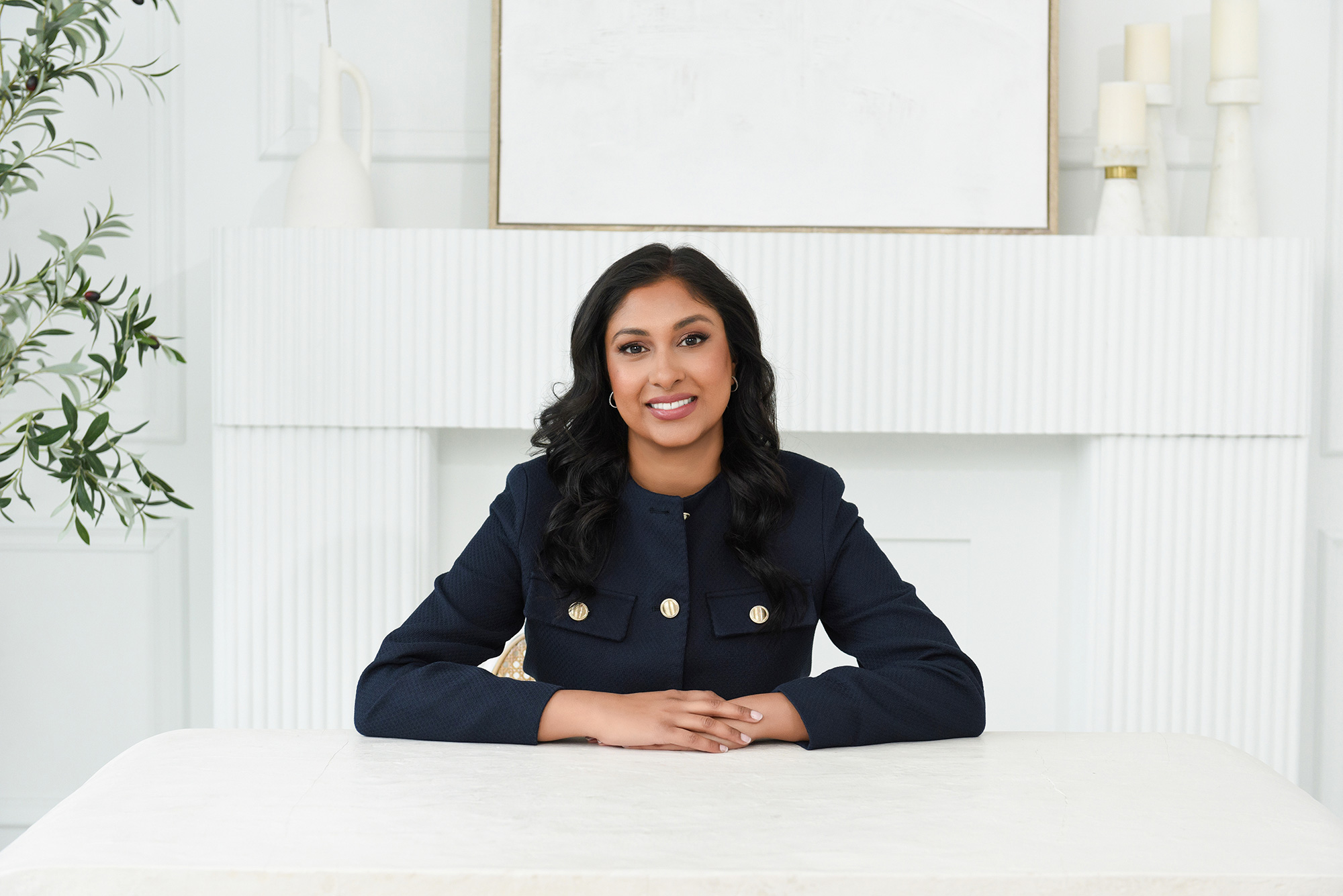 Entrepreneur in a chic office setting, illustrating the role of branding photography in business.