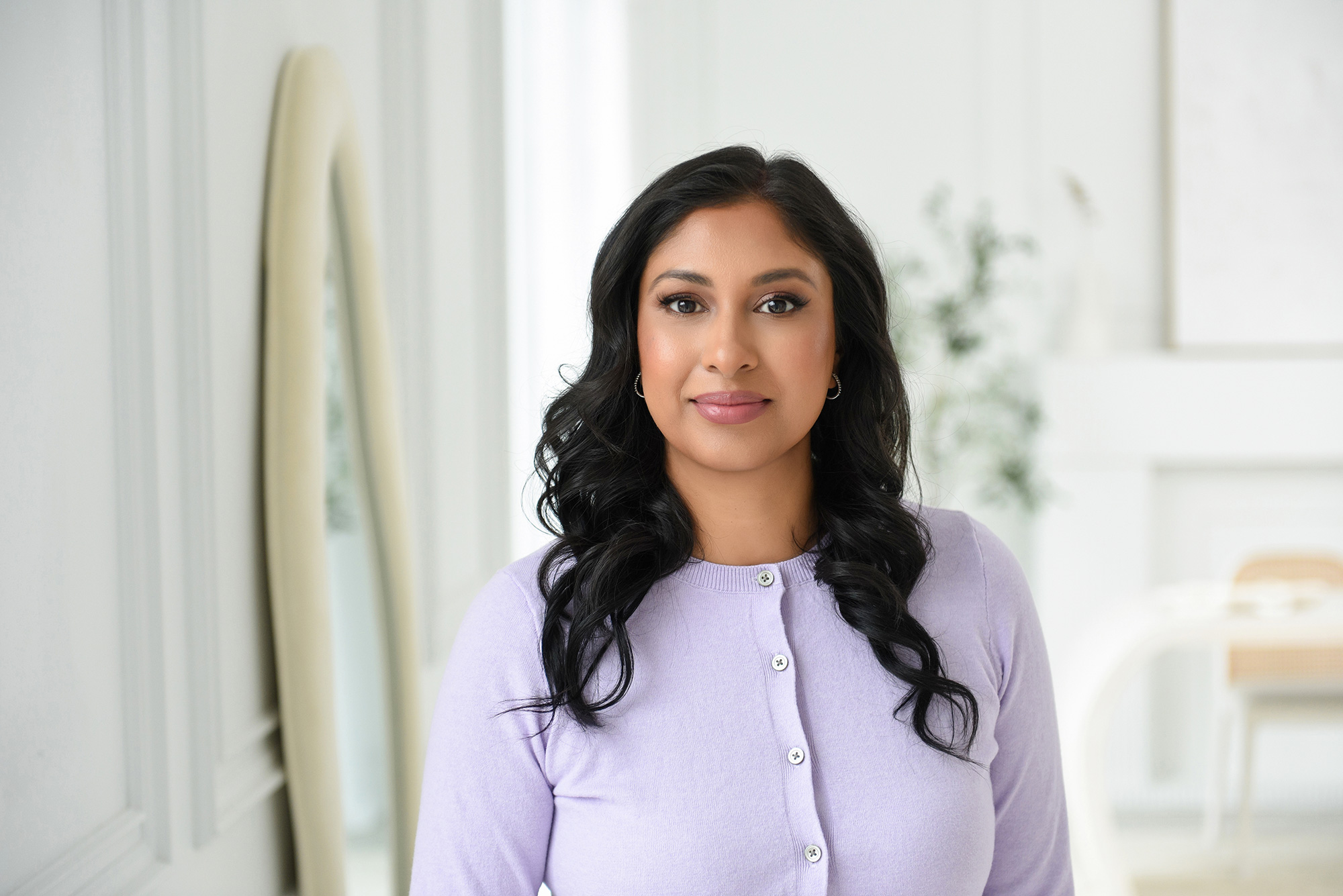 Female executive in a sophisticated workspace, demonstrating the principles of branding photography.
