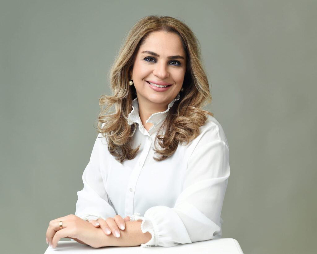 Woman in cream tailored shirt, confident professional expression — Ellahrika Photography personal branding portrait, Milton, Ontario"