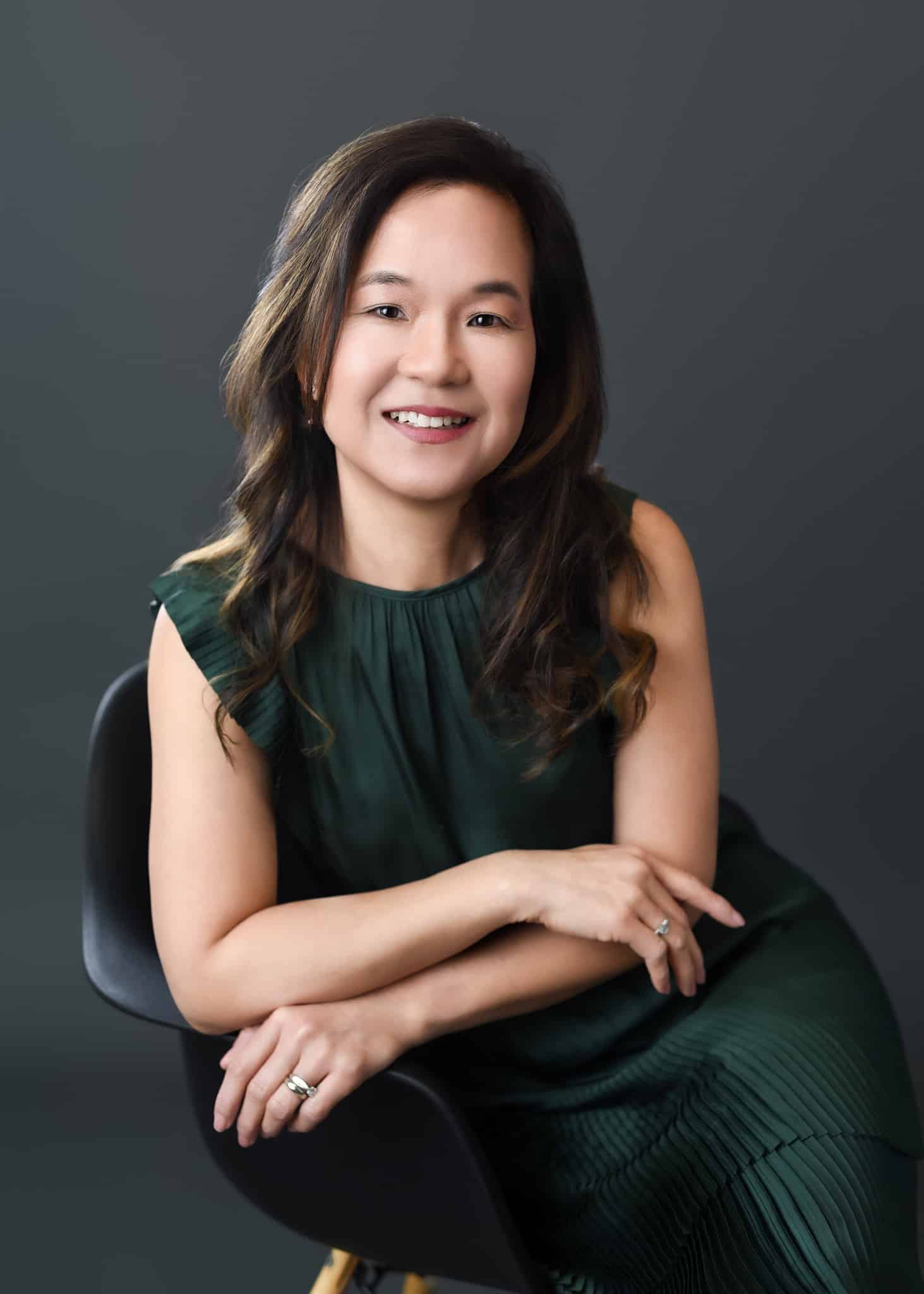 Woman entrepreneur smiling confidently during branding photoshoot at Ellahrika Photography studio in Milton ON