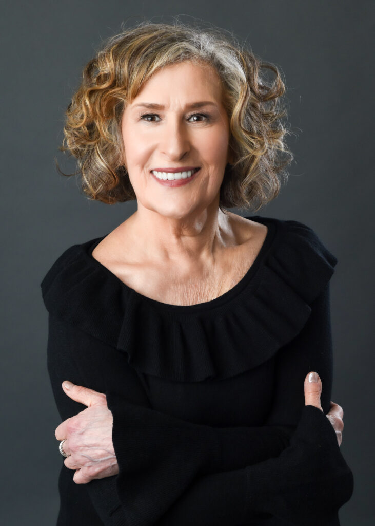Confident woman over 40 looking relaxed and comfortable in front of the camera during a portrait session