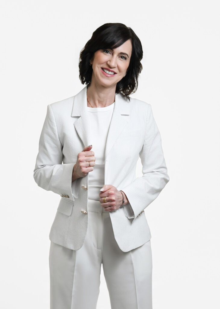 Timeless portrait of confident woman over 40 wearing elegant textured clothing